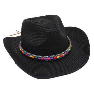 Detail of colorful ethnic beads on a black woven straw cowboy hat with a wide brim