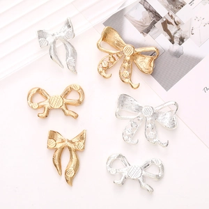 DIY bow-shaped zinc alloy jewelry charms in gold and silver for phone cases and shoes