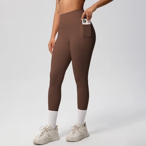 Detail of high waist yoga pants with large side pocket for smartphone storage