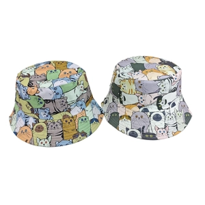 Close-up of casual bucket hats featuring colorful cartoon cat digital print patterns