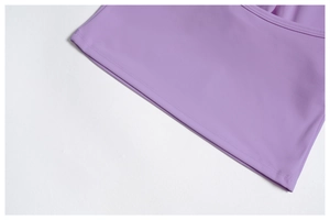 Close-up of double-needle stitched hem on purple brushed yoga set fabric