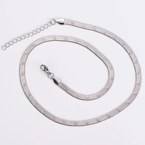 Detailed close-up of a silver stainless steel flat snake chain with lobster clasp on white background