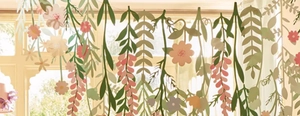 Hanging floral paper garland with pink flowers and green leaves for window display decor