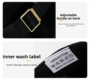 Detail of adjustable metal buckle and 100% cotton wash label on the black baseball cap