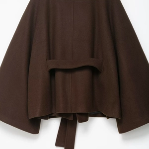 Deep brown wool blend cape coat with detailed back waist belt and thick fabric texture