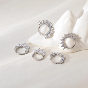 Macro shot of five assorted silver seamless nose rings with cubic zirconia crystal inlay