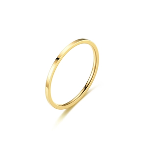 Close-up of minimalist gold titanium steel thin band ring on a white background