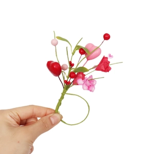 Romantic heart-shaped floral napkin ring with red berries and fabric flowers for weddings