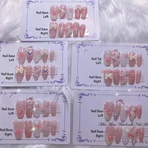 Handmade press-on nail sets featuring white and pink 3D pearls, bows and lace patterns