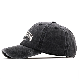 Detail of vintage washed grey baseball cap with Ageless Made white embroidery