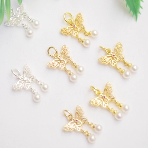 Bowknot butterfly jewelry pendant with 14K gold plating, pearls and sparkling crystals