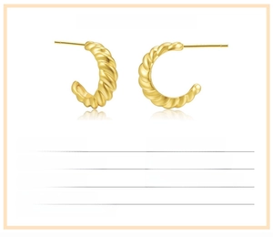 Detail view of twisted C-shape brass earrings in polished gold finish with specifications