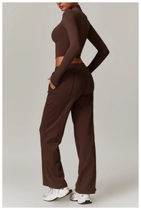 Side-back view of high-waisted wide-leg sweatpants and matching long-sleeve crop top