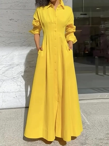 Elegant long-sleeved yellow maxi shirt dress with button-down design and waist pleats