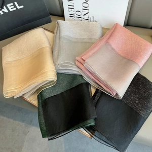 Detail of multi-colored double-layer silk scarves with metallic gold thread shimmer