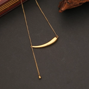 Close-up of golden stainless steel necklace with geometric bar and water drop pendant