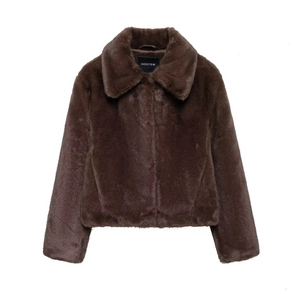 Detail of soft dark brown faux fur texture and large lapel collar on the fashion jacket