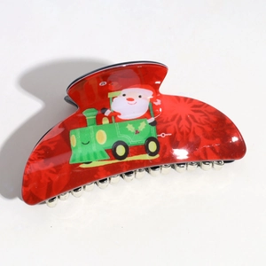 Christmas hair claw clip featuring Santa Claus on a green train over red plastic arch