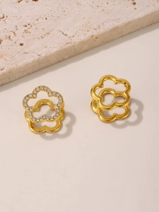 Close-up of 18K gold plated flower buckle earrings with sparkling cubic zirconia inlay