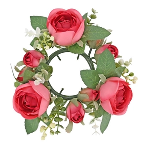 Detailed top view of pink artificial rose candle ring with green leaves and white buds