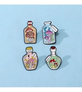Detailed view of four colorful enamel mushroom magic potion bottles with 'MADE OF MAGIC' text
