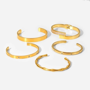 Five-piece gold-plated stainless steel bangle set featuring zircon stones and bamboo design