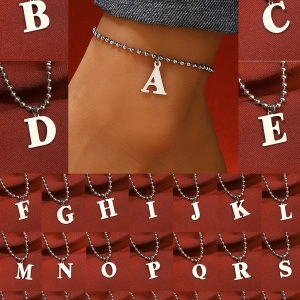 Silver alphabet ankle bracelet showing various letter charms on a delicate bead chain