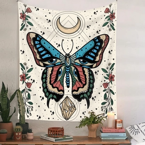 Bohemian butterfly wall tapestry with crescent moon and floral motifs on a white wall