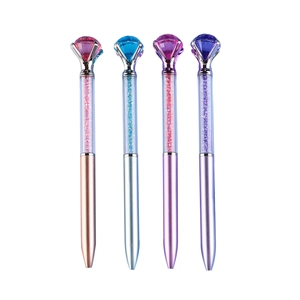 Colorful crystal ballpoint pens with large diamond tops and flowing gemstone fillings
