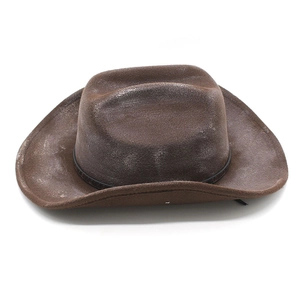 Vintage brown distressed western cowboy hat with wide brim and decorative leather band