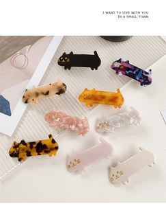 Detailed set of cute cat-shaped acetate hair clips in multiple colors and marble patterns