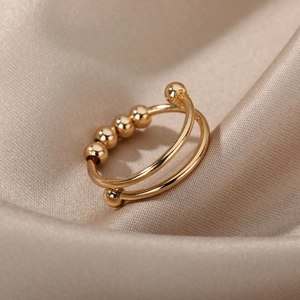 Minimalist 18k gold parallel spiral fidget ring with sliding beads for anxiety relief