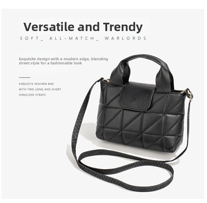 Close-up of black quilted triangular embroidery on mini crossbody bag with straps