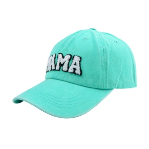 Detail of mint green washed cotton baseball cap with MAMA white chenille embroidery