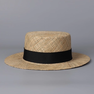 Detail of premium handmade flat top straw boater hat with black grosgrain ribbon trim