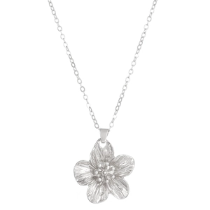 Detail of silver flower pendant necklace with textured petals on a clean white background