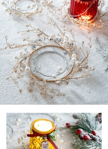 Detail of Christmas candle ring with gold wire branches, white pearls and silver glitter