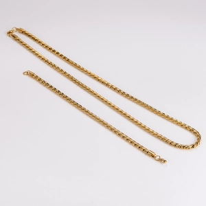 Polished gold stainless steel dragon bone chain necklace for men on white background