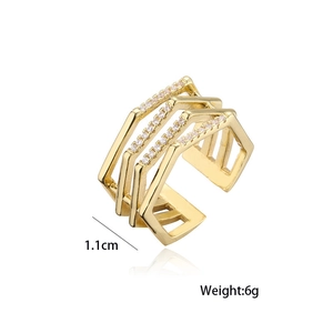 Detail view of gold geometric layered ring with cubic zirconia showing 1.1cm width