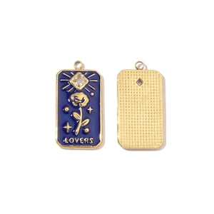 Detail of gold-plated pendant with blue enamel, rose pattern, and Lovers inscription