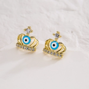 Macro shot of 18K gold plated crown stud earrings with zircon and devil eye beads