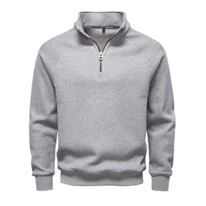 Detail of grey men's quarter-zip sweatshirt with vertical ribbed knit texture and stand collar