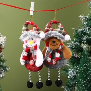 Close-up of festive fabric Christmas ornaments featuring snowman and bear designs