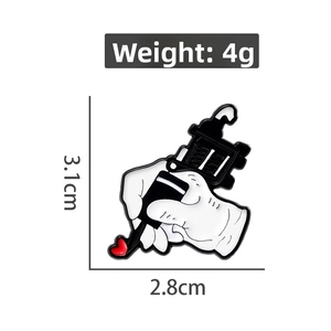 Detailed view of black and white tattoo machine enamel pin with dimensions and weight info