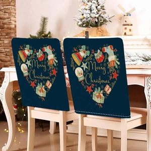 Detail of navy blue Merry Christmas chair covers with gold festive heart patterns