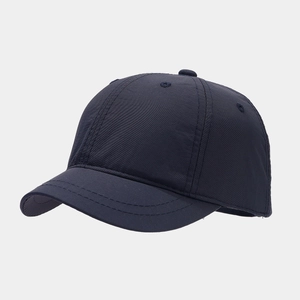 Detail of short brim baseball cap in navy blue with breathable vents and waterproof fabric