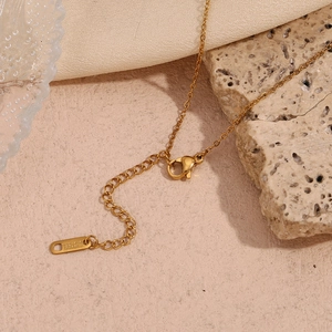 Detail of 18K gold-plated stainless steel chain with lobster clasp and extender