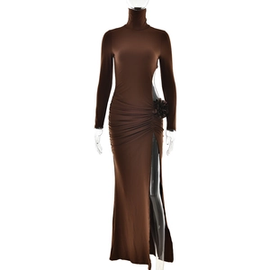 Detail view of deep brown high-neck dress featuring side slit and waist flower decoration