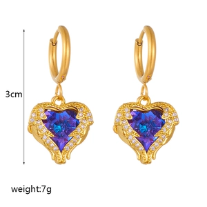 Gold winged heart earrings with blue purple gradient crystals and diamond accents