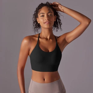Detail of black sports bra with thin straps and U-neck in soft brushed nylon fabric